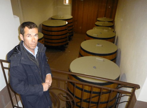 Stéphane Dief with his wooden fermenting vats used for Clos Manou
